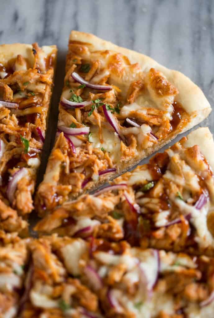 Close up photo of a slice of bbq chicken pizza.