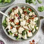 Cauliflower Salad made with raw cauliflower and cooked bacon,served in a bowl.