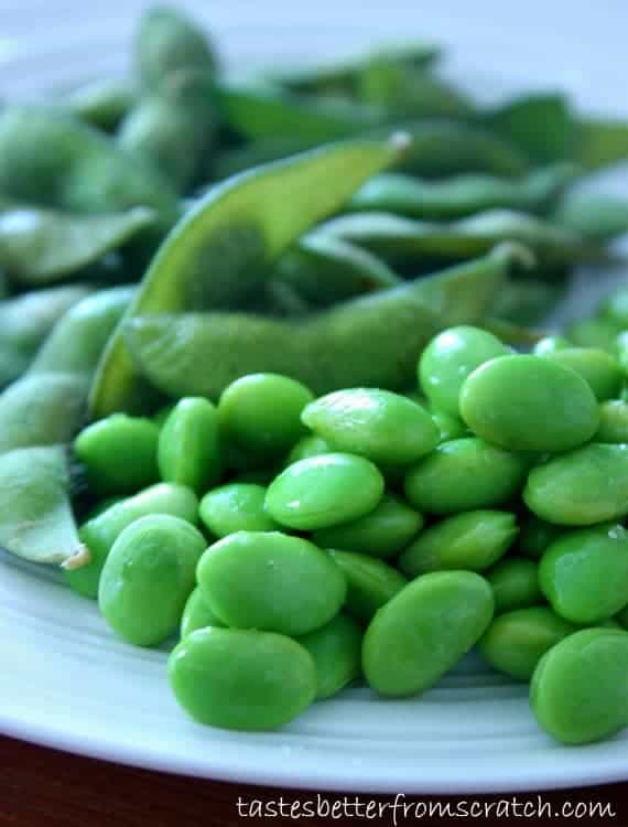 Edamame and soy beans on a white plate