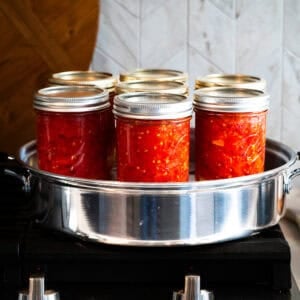 This Canned Tomatoes recipe is easy, quick, and gives you healthy, flavorful tomatoes to use in your recipes all year round!