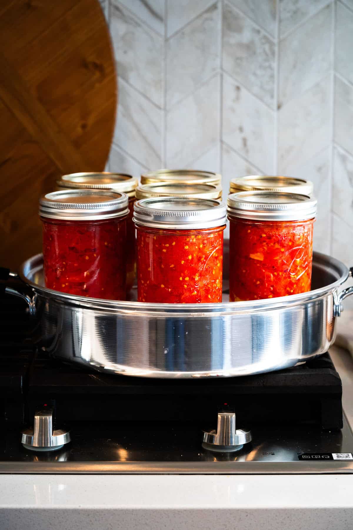 This Canned Tomatoes recipe is easy, quick, and gives you healthy, flavorful tomatoes to use in your recipes all year round!