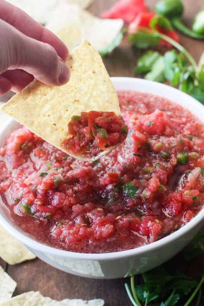A chip scooping up some homemade salsa.