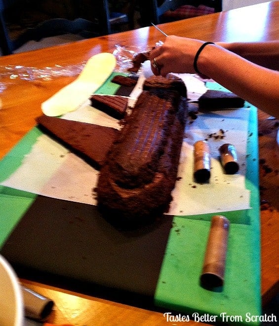 Airplane cake being assembled.