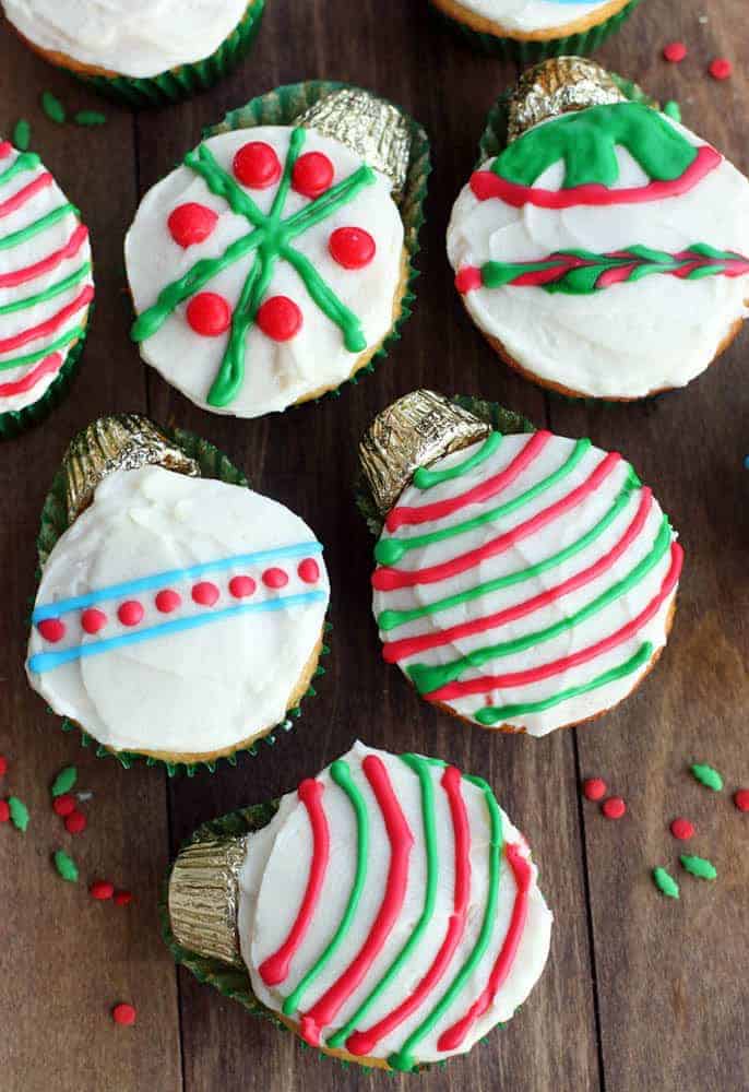 Cupcakes decorated like different Christmas ornaments.