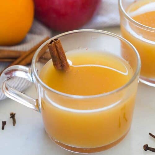 Hot Wassail is one of my favorite easy holiday drinks. A delicious warm cider drink that combines the flavors of orange and apple with cinnamon and spices. | tastesbetterfromscratch.com