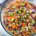 Quinoa tossed with a medley of fresh, crunchy veggies and drizzled with a delicious peanut sauce. Everyone always loves this fun and delicious and easy quinoa salad. | tastesbetterfromscratch.com