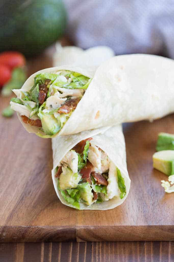 Two Chicken Bacon Avocado Wraps, one laying on the other. 
