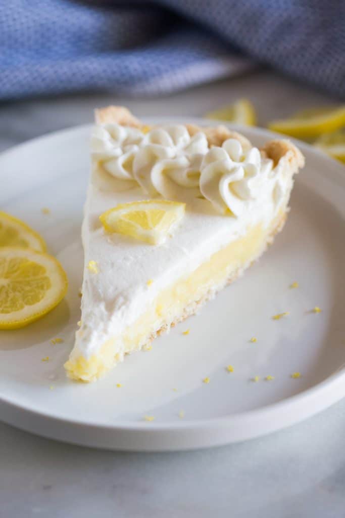 A slice of the BEST Lemon Sour Cream Pie - tastesbetterfromscratch.com