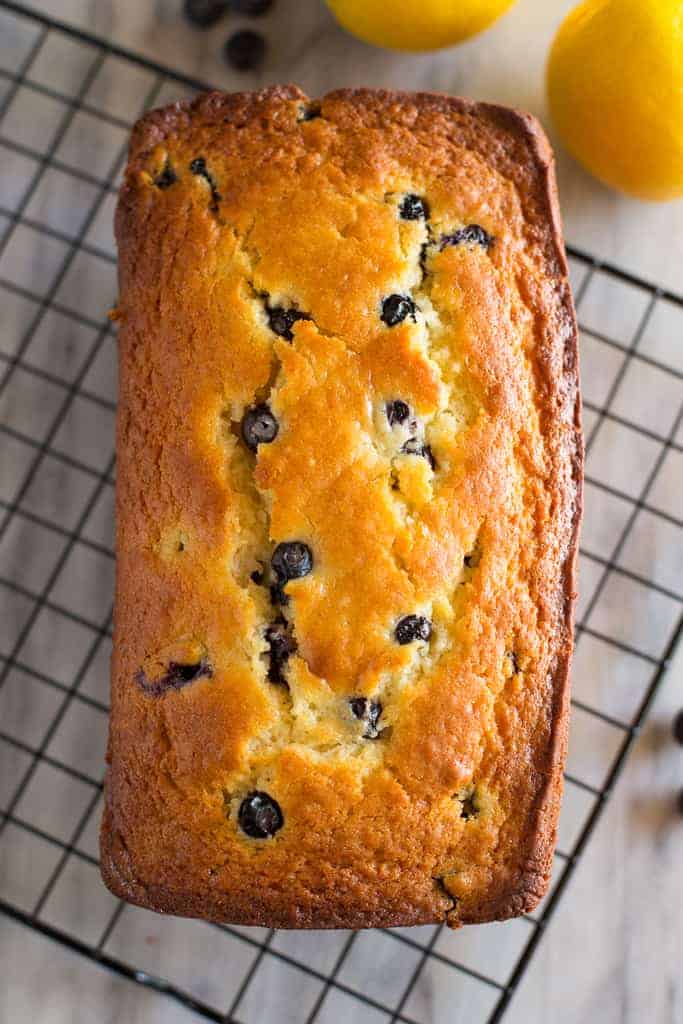 Overhead photo of baked lemon blueberry bread on a wire cooling rack.