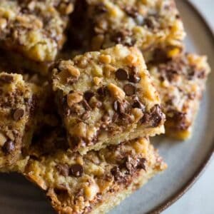 A plate stacked with toffee chocolate chip cookie bars