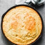 A cast iron skillet with baked cornbread in it.