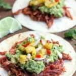 Shredded Pork Tacos with Chunky Guacamole and Grilled Pineapple Salsa from TastesBetterFromScratch.com