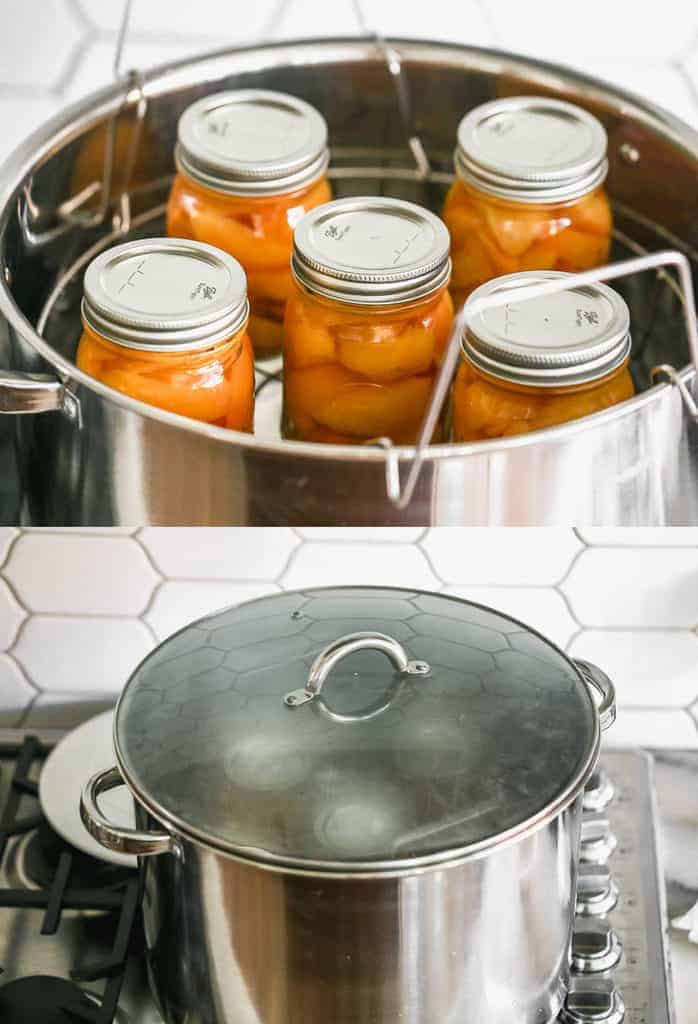Quart jars with sliced peaches in a water bath canner, then processing in boiling water with the lid on the canner.