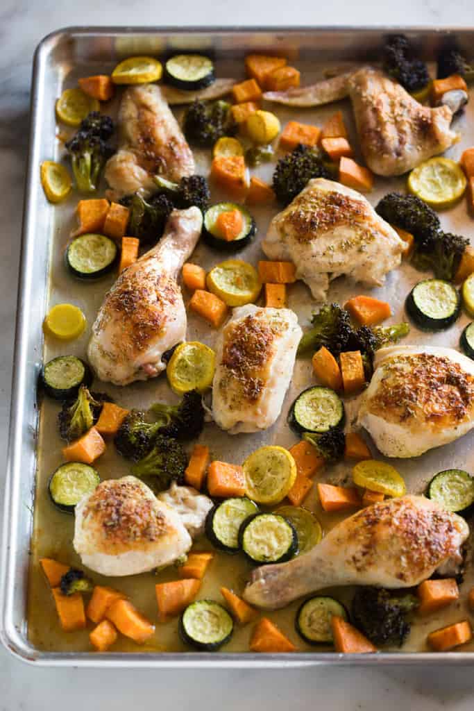 One Pan Roast Chicken and Vegetables cooked on a sheet pan and ready, start to finish, in just one hour!