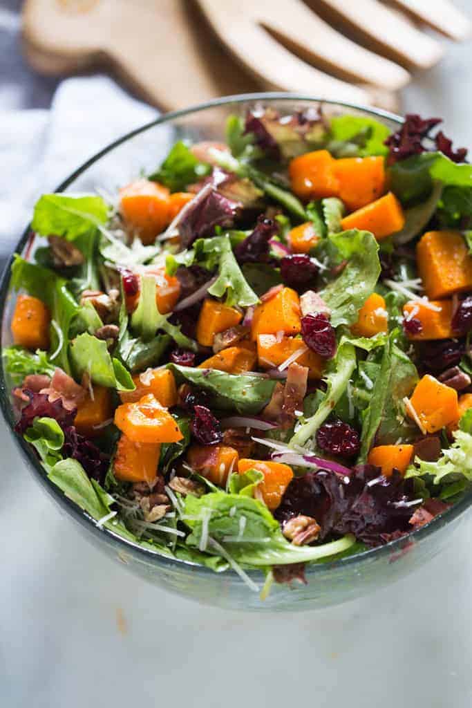 Roasted Butternut Squash Salad with pecans, bacon, onion, craisins, parmesan cheese and a simple balsamic vinaigrette. | tastesbetterfromscratch.com