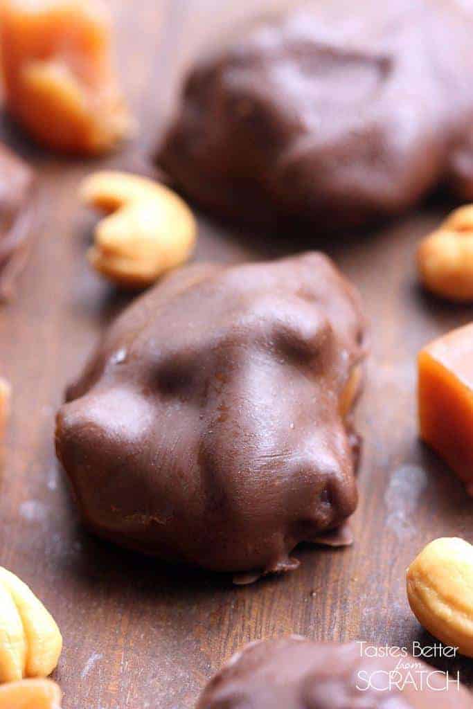 A close up image of a Caramel Cashew Clusters on a wooden board.