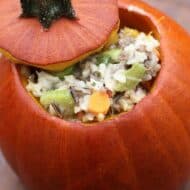 Dinner in a Pumpkin-- a delicious, hearty rice casserole baked inside a delicious pumpkin!