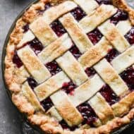 Overhead view of a berry pie with a lattice crust.