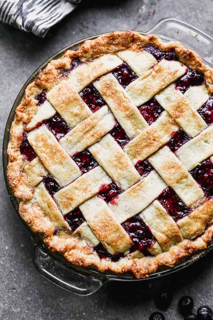 Overhead view of a berry pie with a lattice crust.