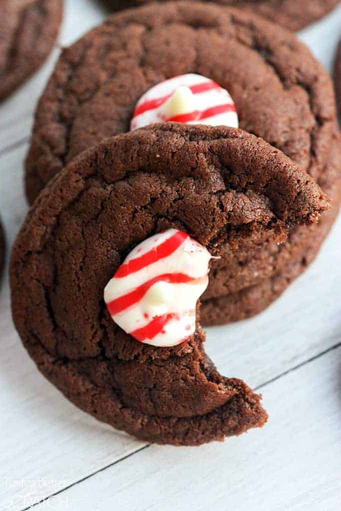 One Chocolate Peppermint Kiss Cookies with a bite taken out of it.