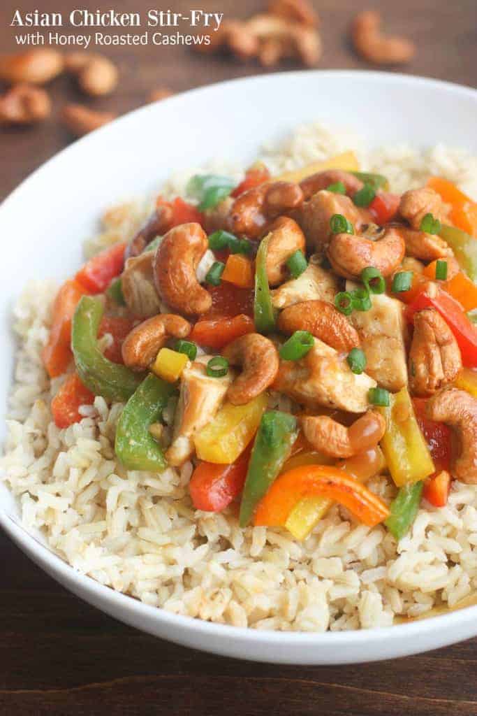 Skinny Asian Chicken Stir-Fry with Honey Roasted Cashews - an easy, healthy, flavorful meal packed with protein and veggies and served over brown rice. | Tastes Better From Scratch
