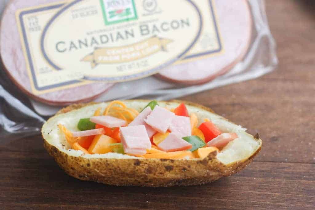 Breakfast Potato Boats with Canadian bacon, peppers, cheese and a baked egg. | Tastes Better From Scratch