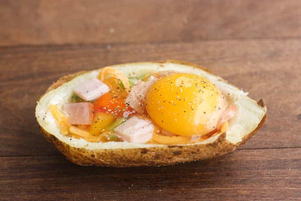 Breakfast Potato Boats with Canadian bacon, peppers, cheese and a baked egg. | Tastes Better From Scratch