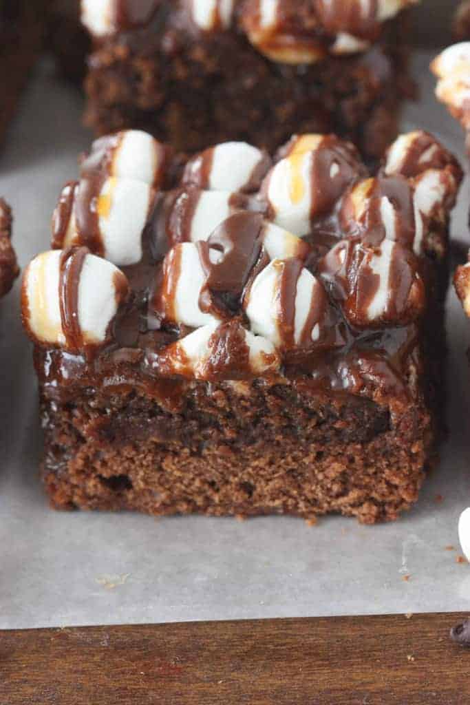 A Caramel Poke Rocky Road Brownie with marshmallows, chocolate, and caramel.