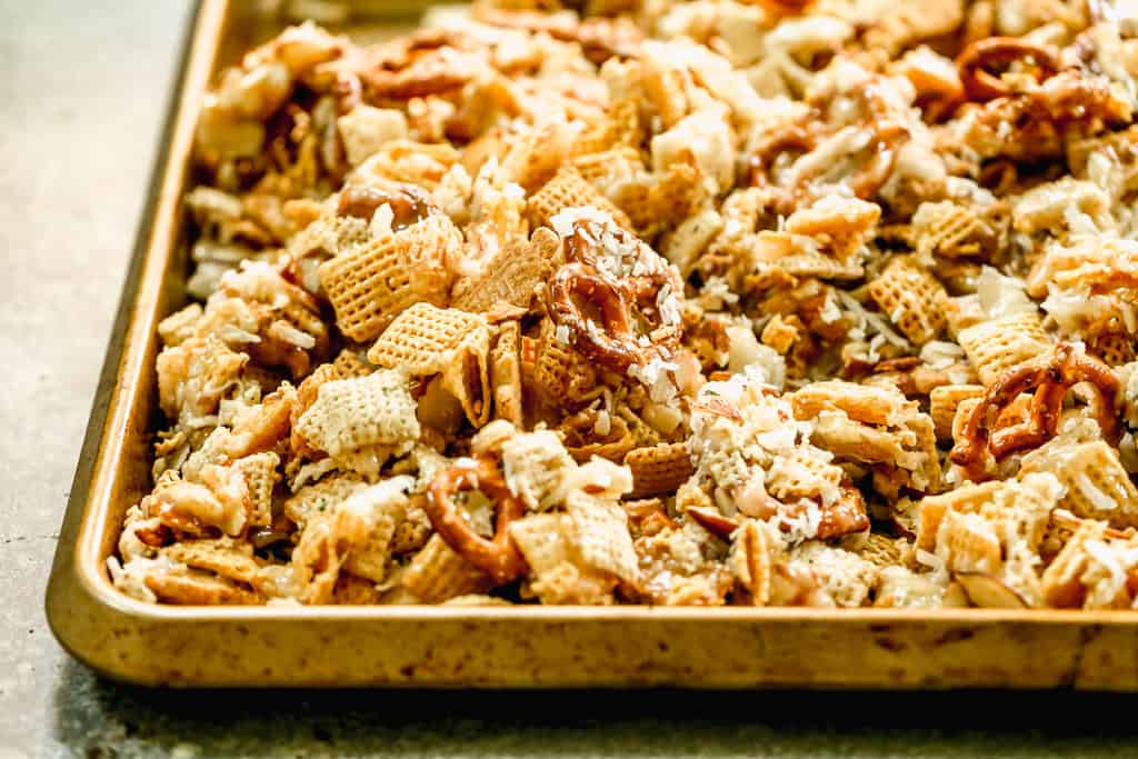 Sweet Chex Mix spread out on a baking sheet.
