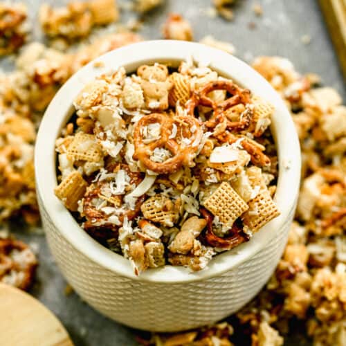 A white bowl filled with the best Sweet Chex Mix Recipe.