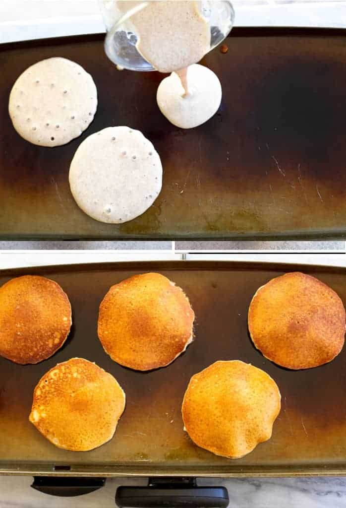 Batter being poured on a hot griddle and another griddle cooking whole wheat pancakes on it. 