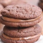 Chocolate Nutella Sandwich Cookies - The BEST chewy chocolate nutella cookies, sandwiched together with a spoonful of nutella in the center.