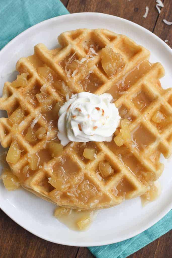 An overhead shot of a Coconut Cream Waffles with Pineapple Syrup 