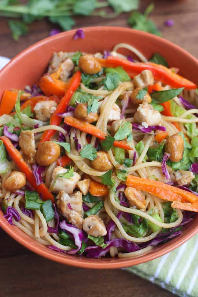 Better than takeout Thai Peanut Chicken Pasta - The perfect easy dinner recipe that's bursting with flavor and uses simple pantry ingredients with sautéed veggies, chicken and a creamy thai peanut sauce. | Tastes Better From Scratch