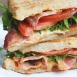 Pimento Cheese BLT Sandwich. A warm, cheese sandwich made with sourdough bread, slathered with an easy homemade pimento cheese spread. Layered with bacon, lettuce and tomatoes. | Tastes Better From Scratch