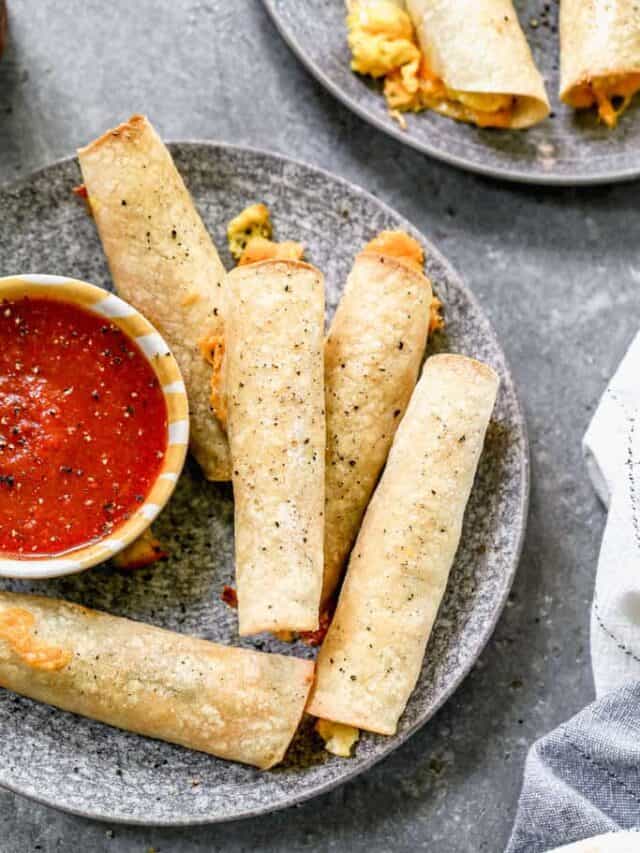 These crispy breakfast taquitos are filled with eggs, cheese, and sausage. They are easy to make ahead and perfect for dipping in salsa on busy mornings.
