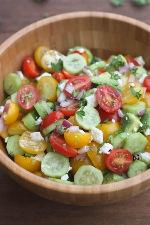 25 Best side dishes to bring to a BBQ including Tomato Cucumber Avocado Pasta Salad from tastesbetterfromscratch.com