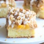 Peach Crumb Cake - a soft and delicious cake layered with fresh peaches and a sweet cinnamon crumb topping. Makes a delicious brunch or serve warm with vanilla ice cream. | Tastes Better From Scratch