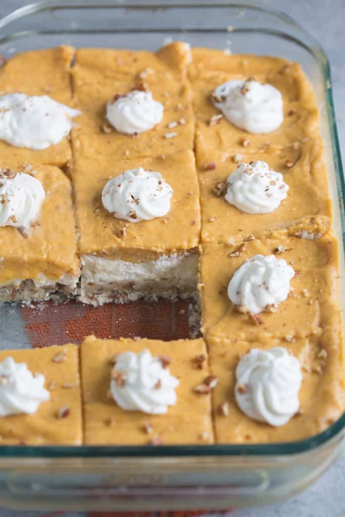 Pumpkin Dream Dessert is a layered pudding dessert with a soft shortbread crust, whipped sweet cream cheese layer and pumpkin pudding layer. We love this easy fall dessert! | Tastes Better From Scratch