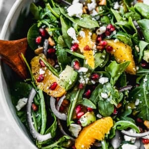 This arugula Pomegranate Salad recipe is colorful, bright, and so flavorful! It's perfect for a holiday meal or anytime!