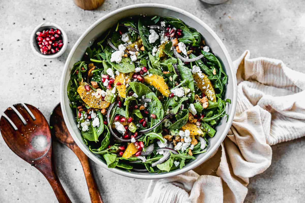 This arugula Pomegranate Salad recipe is colorful, bright, and so flavorful! It's perfect for a holiday meal or anytime!