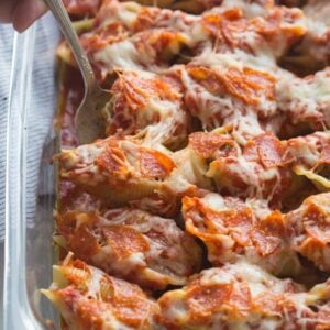 Pizza Stuffed Shells with tender noddles stuffed with a "pizza supreme" mixture and layered with sauce, pepperoni and cheese. | Tastes Better From Scratch