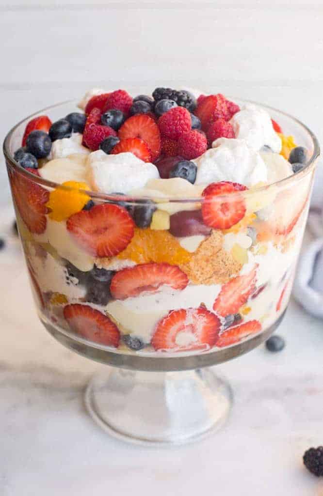 A trifle dish layered with fruit, pudding and cake. 
