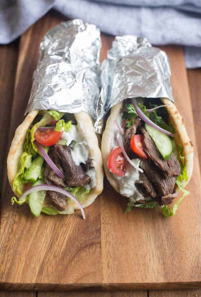 Instant pot Beef Gyros on a wooden board.
