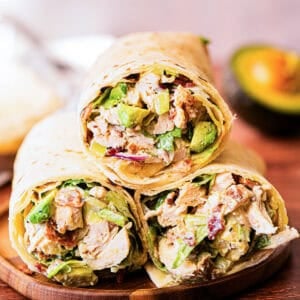 This healthy Chicken Avocado Wrap recipe is loaded with chicken, avocado, bacon, lettuce, and a creamy lemon sauce. It's ready in just 15 minutes and absolutely delicious!