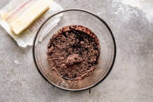 Oil and cocoa powder in a mixing bowl to make brownies.