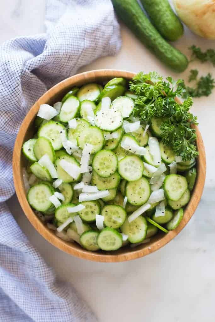 An overhead view of Cucumber Onion Salad in a bowl.