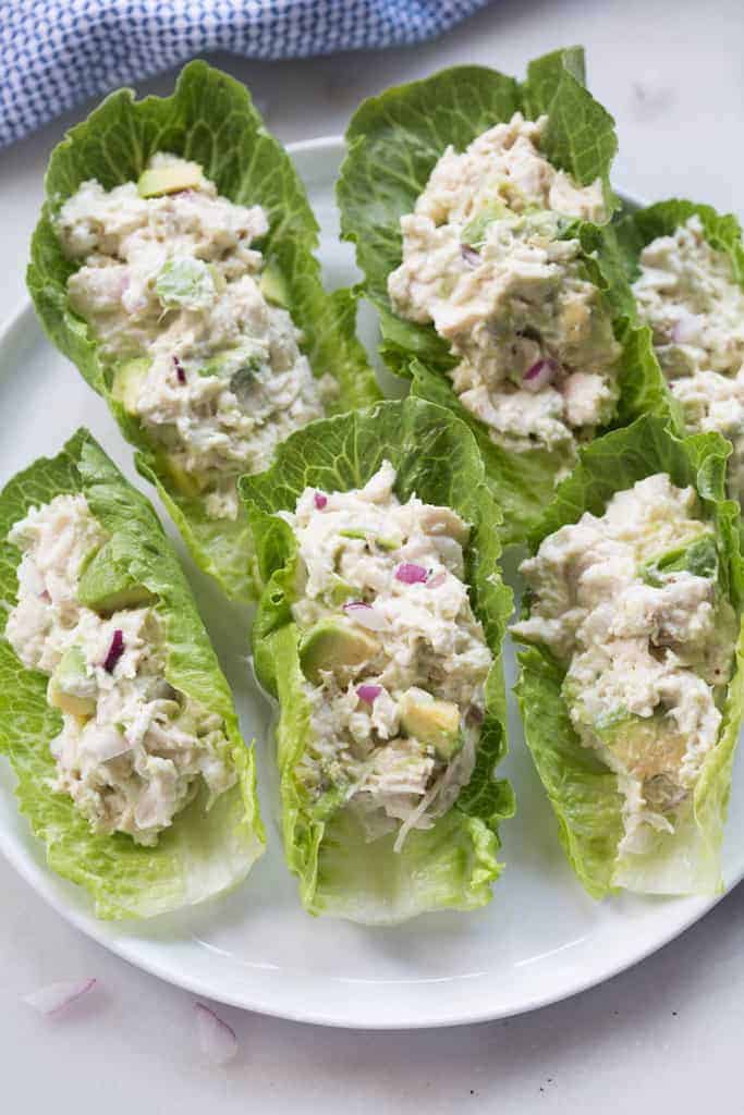 Several romaine leaves filled with Avocado Chicken Salad 