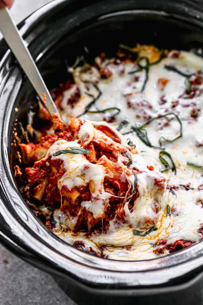 Crock Pot Baked Ziti cooked in a slow cooker, with mozzarella cheese melted on top.