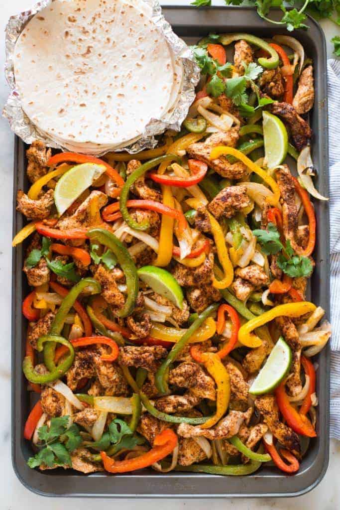 Sheet Pan Chicken Fajitas are one of my favorite easy one pan meals, and they're ready in less than 30 minutes! | tastesbetterfromscratch.com